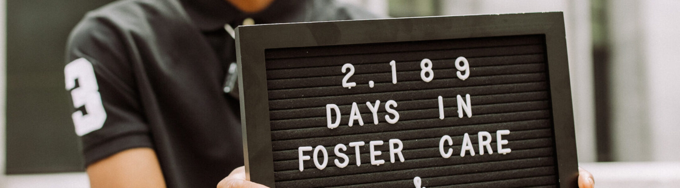 Darian holding sign 2189 days in foster care