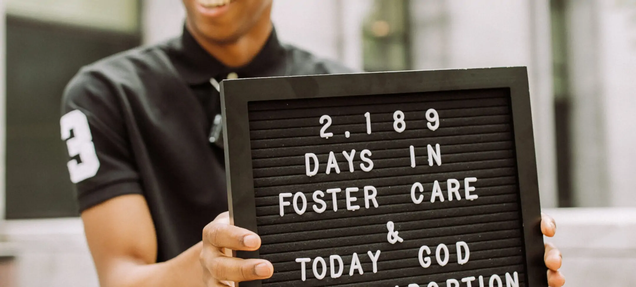 Darian holding sign 2189 days in foster care