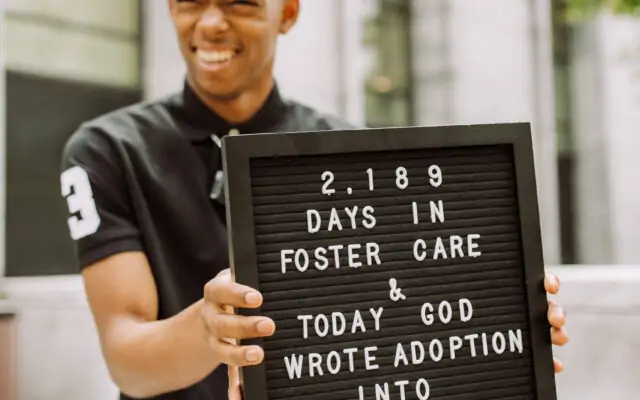 Darian holding sign 2189 days in foster care